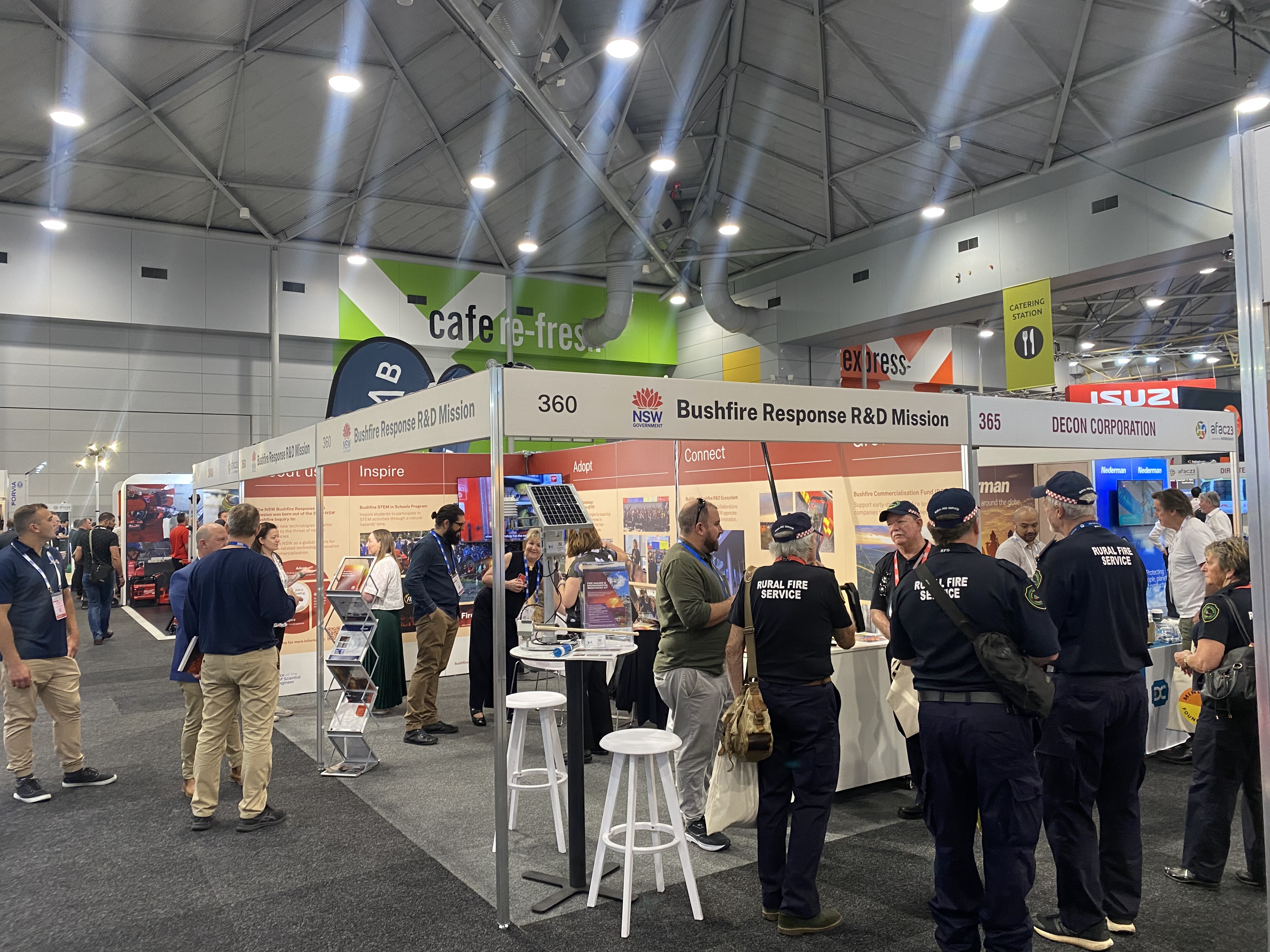 The Bushfire Response R&D Mission stand at AFAC23.with people attending.